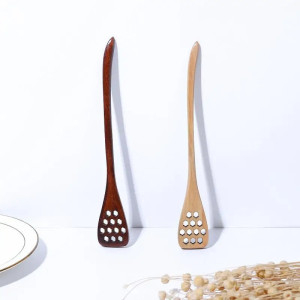 Vue complète de la Cuillère trouée en bois pour le miel ou pour bien remuer