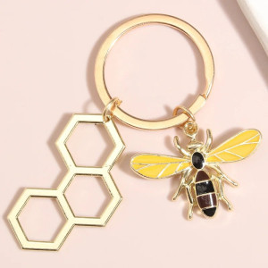Llavero Abeja Hexágono Dorado – Minimalismo y Naturaleza