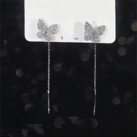 détails Boucles d'oreilles papillon en or et argent avec long pendant