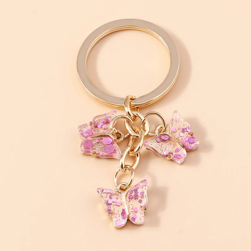 Porte-clés papillon en résine transparente avec paillettes - Couleur Rose