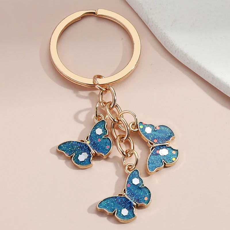 Porte-clés papillon bleu étincelant